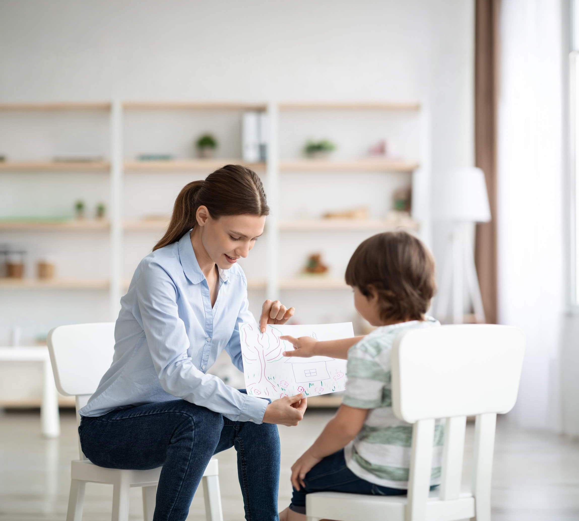 A therapist working with a child during an in-home ABA session in Missouri