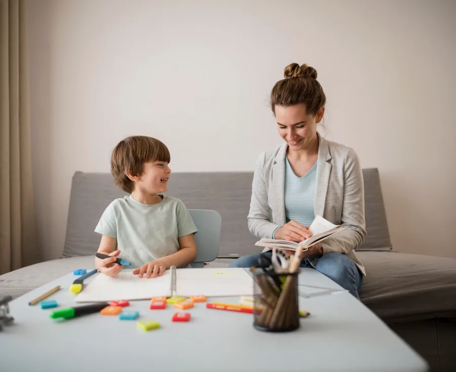 A therapist working with a child during an in-home ABA session in Utah